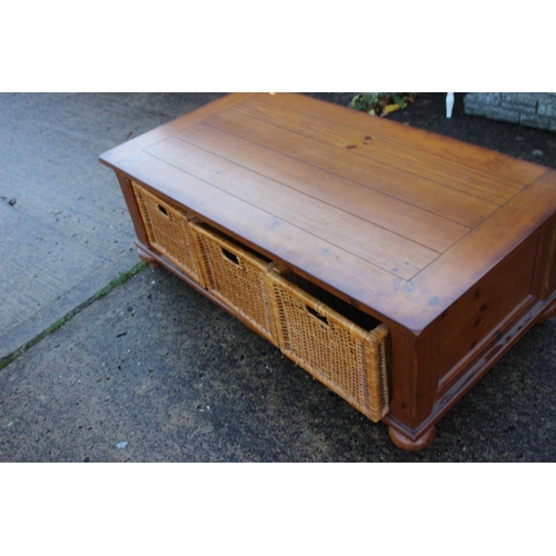 460 - A waxed pine low coffee table, fitted three basket drawers, 50