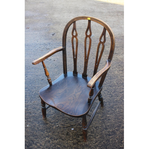 465 - A Windsor lath back nursing chair with cane seat, on turned and stretchered supports, and a Windsor ... 