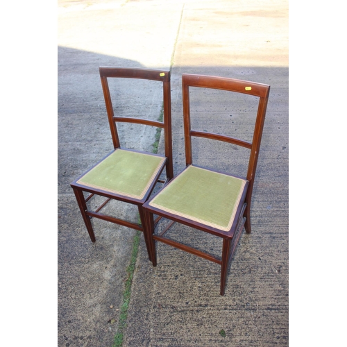 466 - A pair of Edwardian mahogany and box line inlaid bedroom chairs with padded seats, on square taper s... 