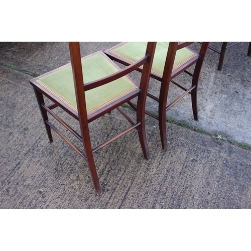 466 - A pair of Edwardian mahogany and box line inlaid bedroom chairs with padded seats, on square taper s... 