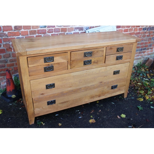 468 - A modern oak custom-made sideboard, fitted six small drawers over two long drawers with ring handles... 