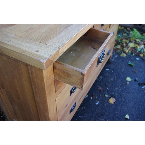 468 - A modern oak custom-made sideboard, fitted six small drawers over two long drawers with ring handles... 