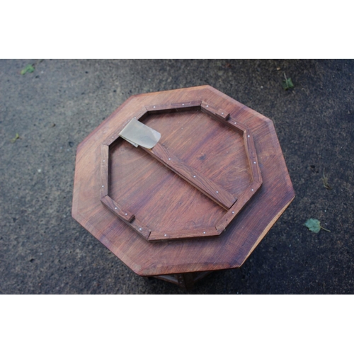 469 - A Kashmir carved and brass inlaid hardwood octagonal occasional table, on folding support, 18