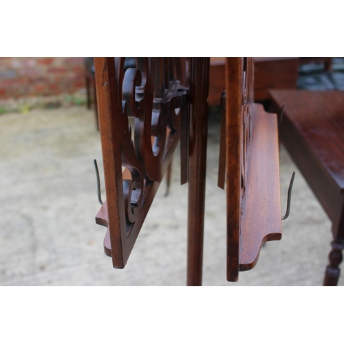 508 - A reproduction mahogany music stand, on tripod splay support