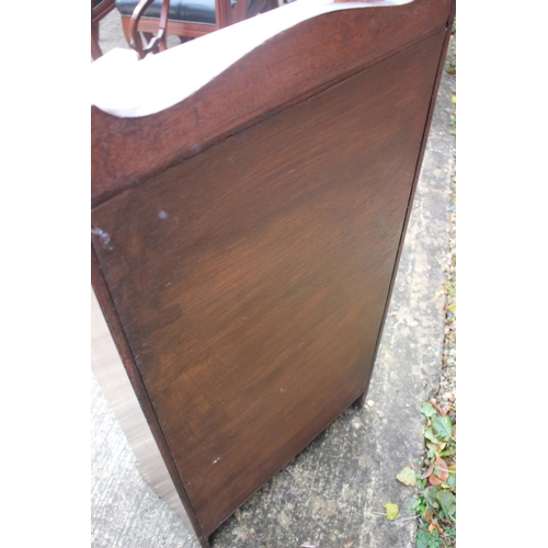 509 - A near pair of 1930s oak four-tier open bookcases, 24