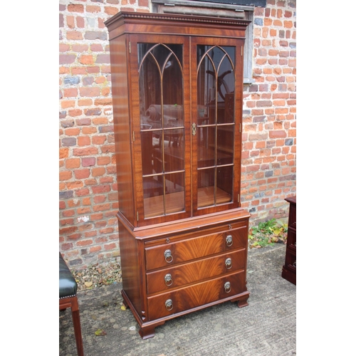 511 - A burr walnut display cabinet, the upper section enclosed Gothic lattice doors over slide and three ... 