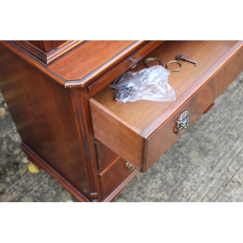 511 - A burr walnut display cabinet, the upper section enclosed Gothic lattice doors over slide and three ... 