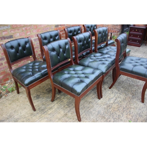 514 - A set of eight reproduction mahogany dining chairs with back upholstered in a green leather, on sabr... 