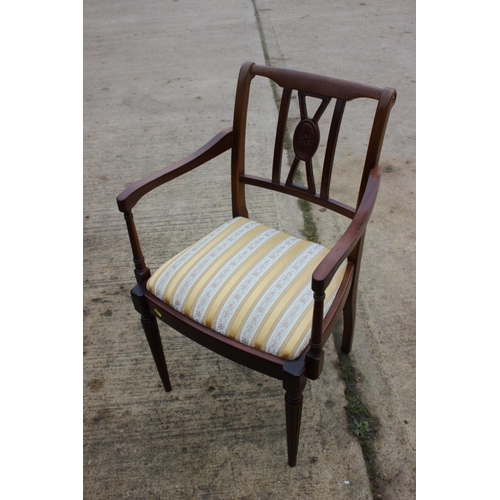 515 - A set of four reproduction mahogany side chairs with drop-in seats and a carver chair with striped d... 