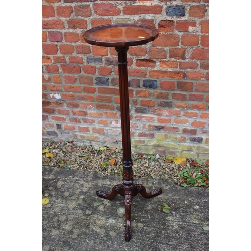 518 - A reproduction mahogany torchere stand, on fluted column and tripod support, 12