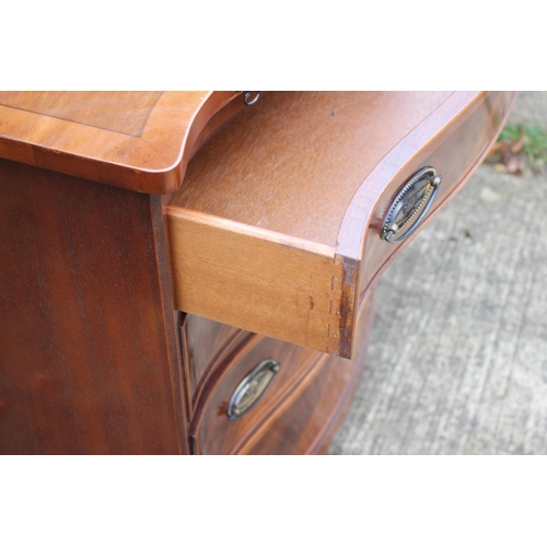 525 - A pair of bachelor's walnut, yew and banded serpentine chests of four long drawers, on splay bracket... 