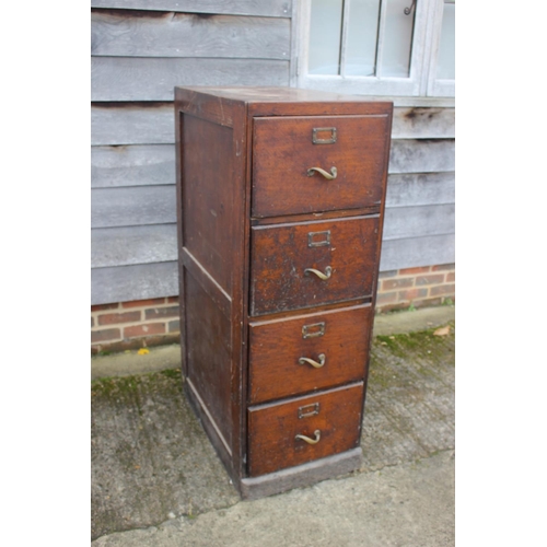 547 - An early 20th century oak four-drawer filing cabinet with brass scroll handles, 18