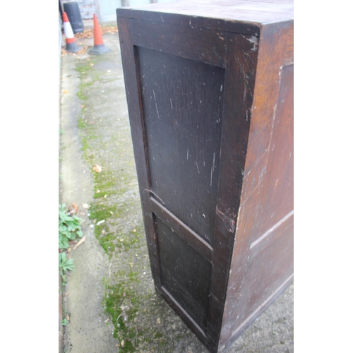 547 - An early 20th century oak four-drawer filing cabinet with brass scroll handles, 18