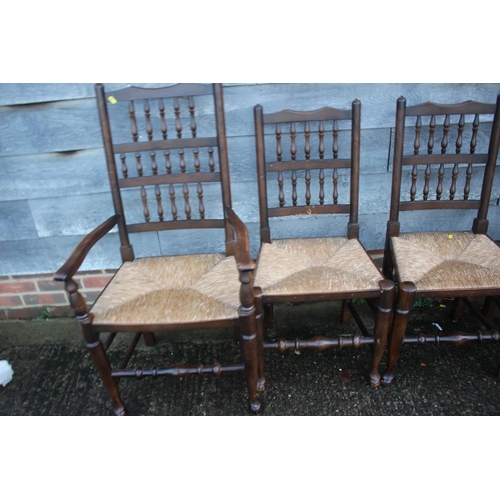 551 - A set of Titchmarsh & Goodwin oak and ash spindle back rush seat dining chairs (4 + 2)