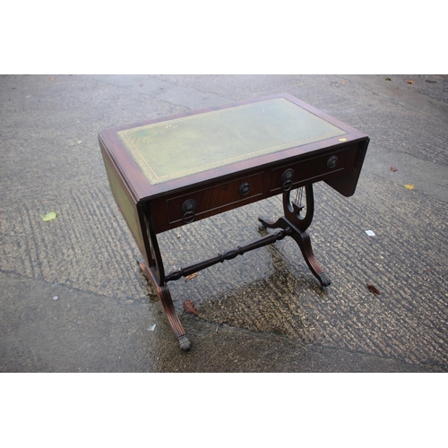 558 - A mahogany sofa table with tooled lined top, fitted two drawers, on liar end splay supports, 34