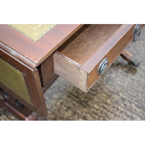 558 - A mahogany sofa table with tooled lined top, fitted two drawers, on liar end splay supports, 34