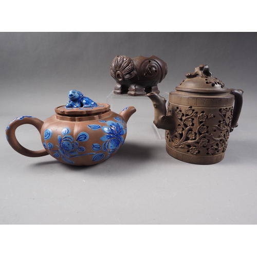 57 - A Chinese Yixing pottery teapot with painted floral decoration and monkey finial, 3 3/4