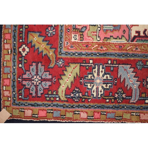 572 - A Caucasian wool rug with central medallion on a blue ground, geometric and floral designs and multi... 