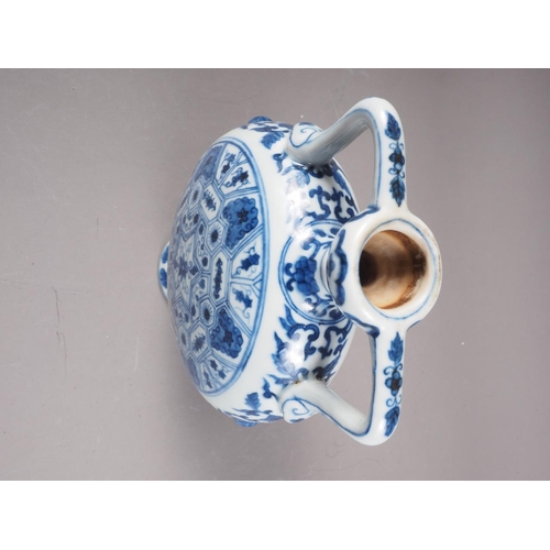 59 - A Chinese porcelain blue and white moon flask with all-over geometric and scroll decoration, 8