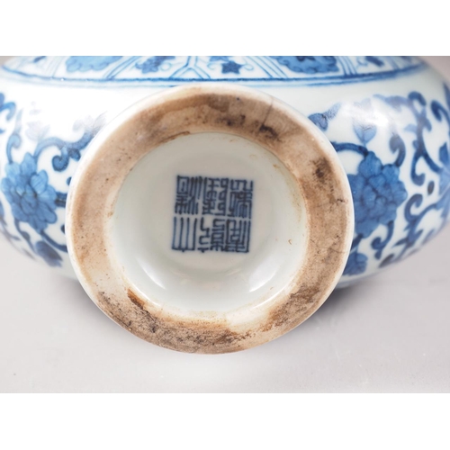 59 - A Chinese porcelain blue and white moon flask with all-over geometric and scroll decoration, 8