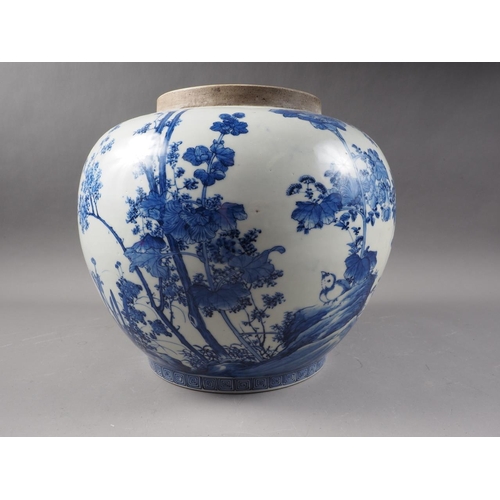 60 - An Oriental porcelain blue and white jar with chrysanthemum and bird decoration, 10 1/2