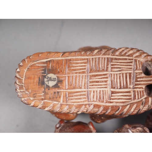 68 - A Chinese hardwood libation cup with relief carved tree, leaf and flower decoration, 3 1/4