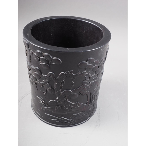 69 - A Chinese Zitan cylindrical brush pot, with carved bird, tree and landscape decoration, 6