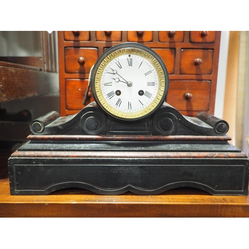 82 - A slate and marble scrolled mantel clock with white enamel dial and Roman numerals, 15 3/4