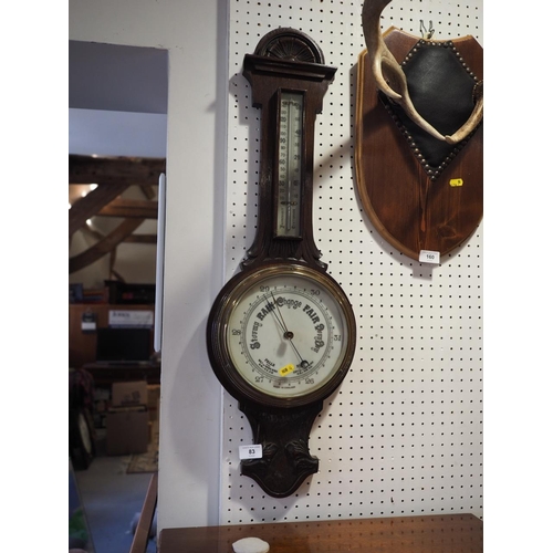 83 - A 19th century carved oak cased aneroid barometer and thermometer, 31