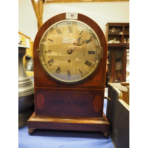 84 - An Edwardian mahogany and line inlaid arch topped mantel clock with fusee movement, silvered dial an... 