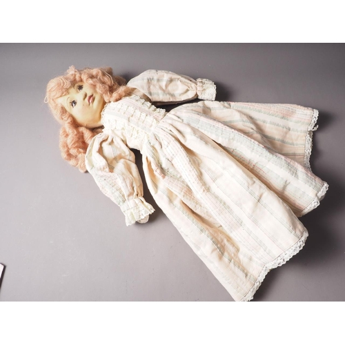 124 - A felt faced doll, dressed in period costume, signed and numbered, Linda Murray, 25 1/2