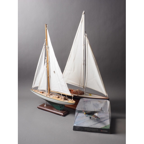 131 - Two scale model yachts, tallest 23 1/4