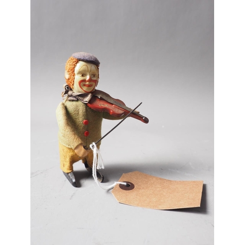 135 - An early 20th century Schuco Clown violinist, 4 1/2