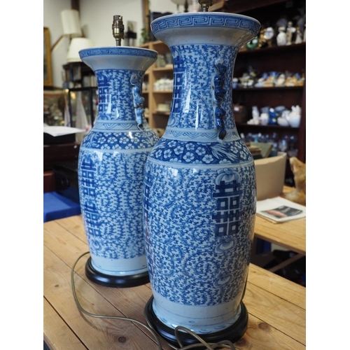 190 - A pair of late 19th century Chinese blue and white porcelain two-handled vases with symbol and scrol... 