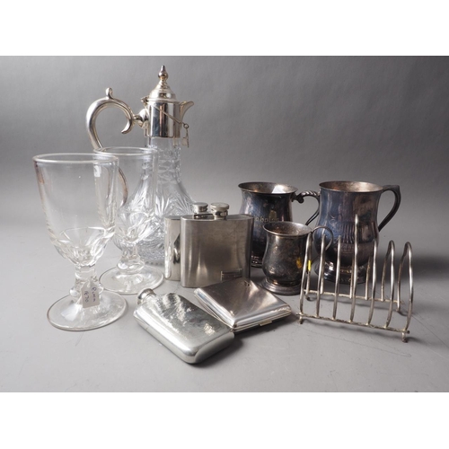 249 - A cut-glass claret jug, with silver plated mounts, a plated 