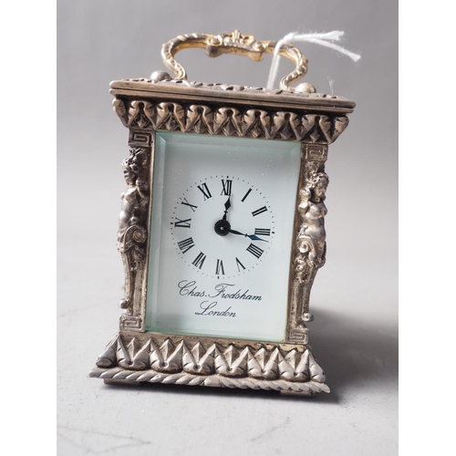 262 - A commemorative Silver Jubilee miniature silver relief cased carriage clock by Charles Frodsham, Lon... 