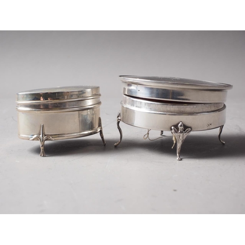 268 - A circular silver and tortoiseshell mounted dressing table box, on four supports, and a similar box ... 