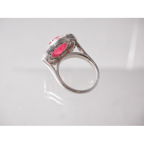 287 - A white metal, stamped 925, Ruby and diamond dress ring, the centre stone 4.7ct approx