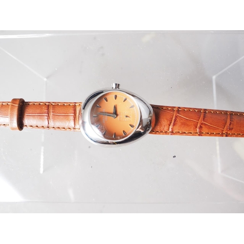 306 - A Jahan Geneve stainless steel cased wristwatch with orange dial and baton numerals, on brown crocod... 