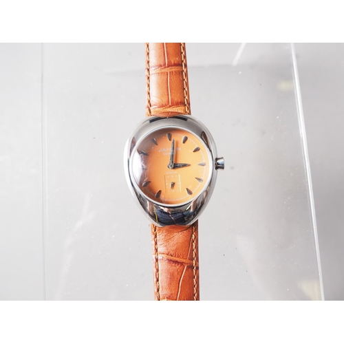 306 - A Jahan Geneve stainless steel cased wristwatch with orange dial and baton numerals, on brown crocod... 