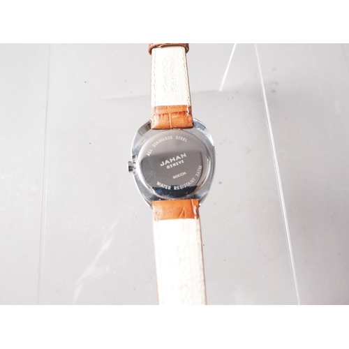 306 - A Jahan Geneve stainless steel cased wristwatch with orange dial and baton numerals, on brown crocod... 