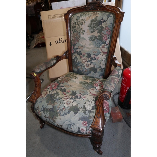 419 - A Victorian carved walnut showframe open armchair, upholstered in a Jacquard fabric, on turned casto... 