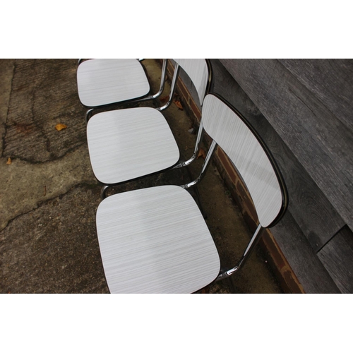 470 - A set of four 1960's chrome and grey and white striped laminate kitchen chairs