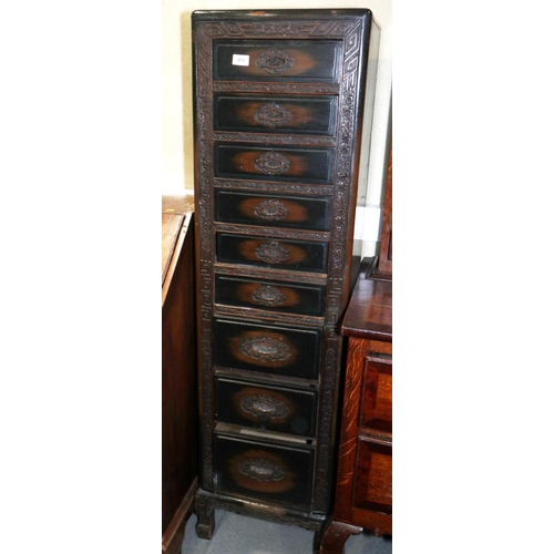 472 - A 1930s Chinese carved hardwood chest of nine drawers, on shaped supports, 16