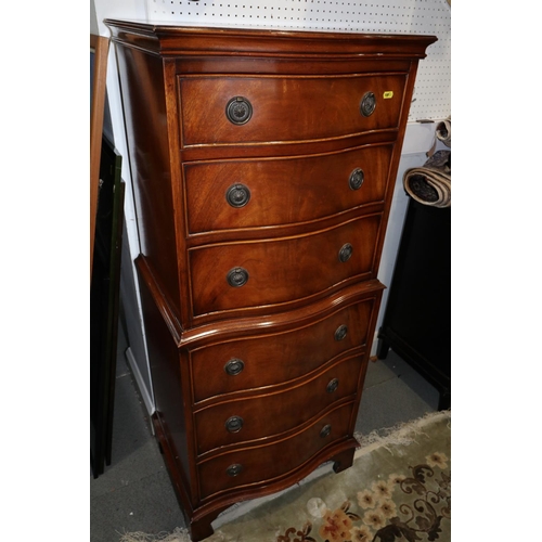 487 - A figured mahogany serpentine front tallboy, fitted six drawers, on bracket feet, 21