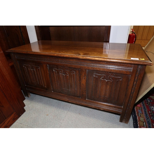 492 - An oak coffer with triple linenfold panel front, on stile supports, 41 1/2