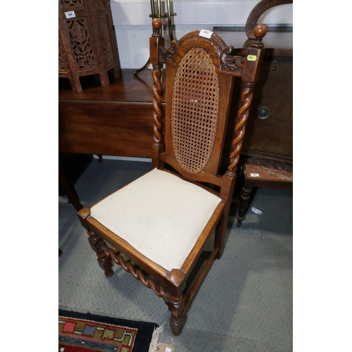 495 - An Edwardian rosewood and inlaid low seat nursing chair, and a cane back occasional chair