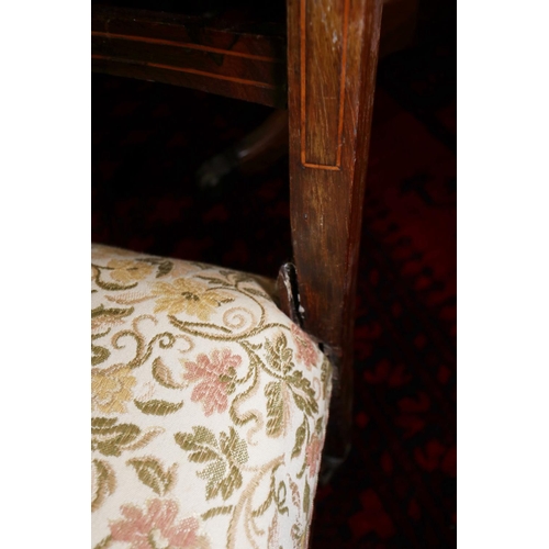 495 - An Edwardian rosewood and inlaid low seat nursing chair, and a cane back occasional chair