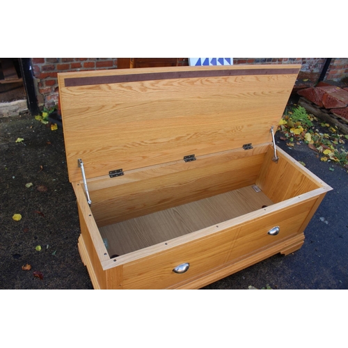 535 - An oak coffer with faux drawer fronts, 46