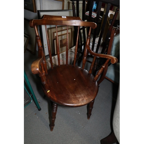 544 - A polished as walnut spindle back elbow chair with circular panel seat, on turned and stretchered su... 